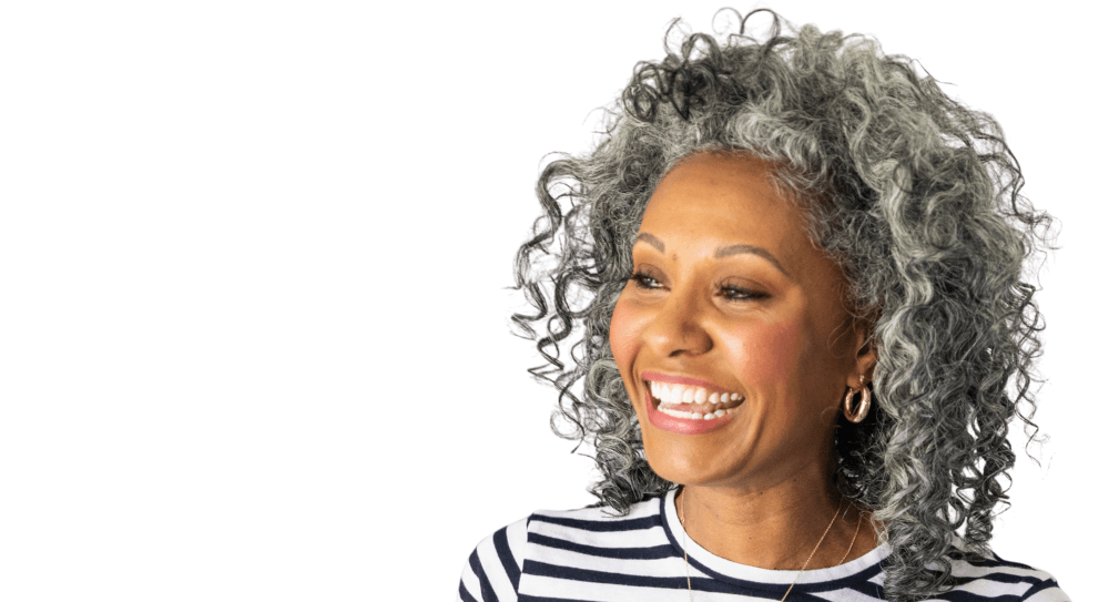 Group of smiling senior people that are all candidates for an implant-supported denture.